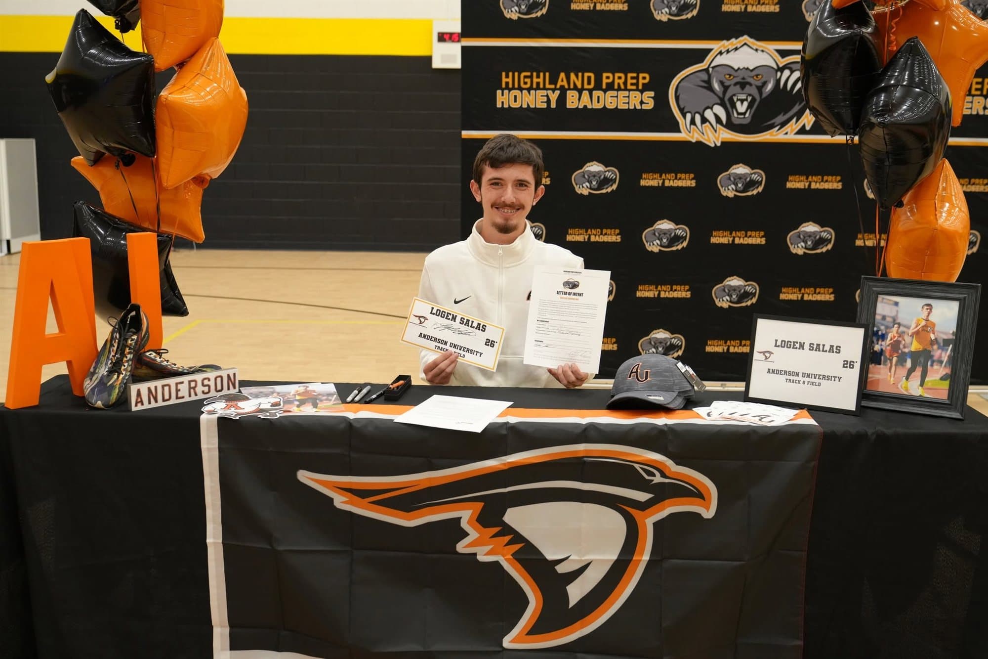 A Highland Prep student-athlete at a college signing