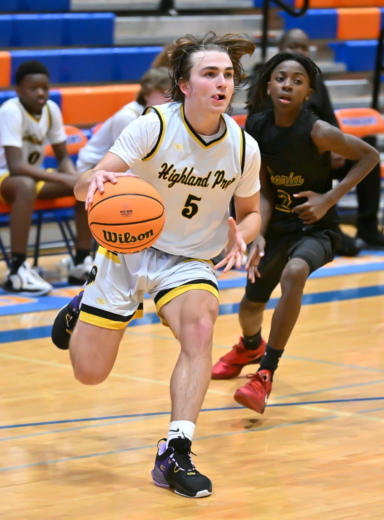 A Highland Prep guard bringing the ball up the court