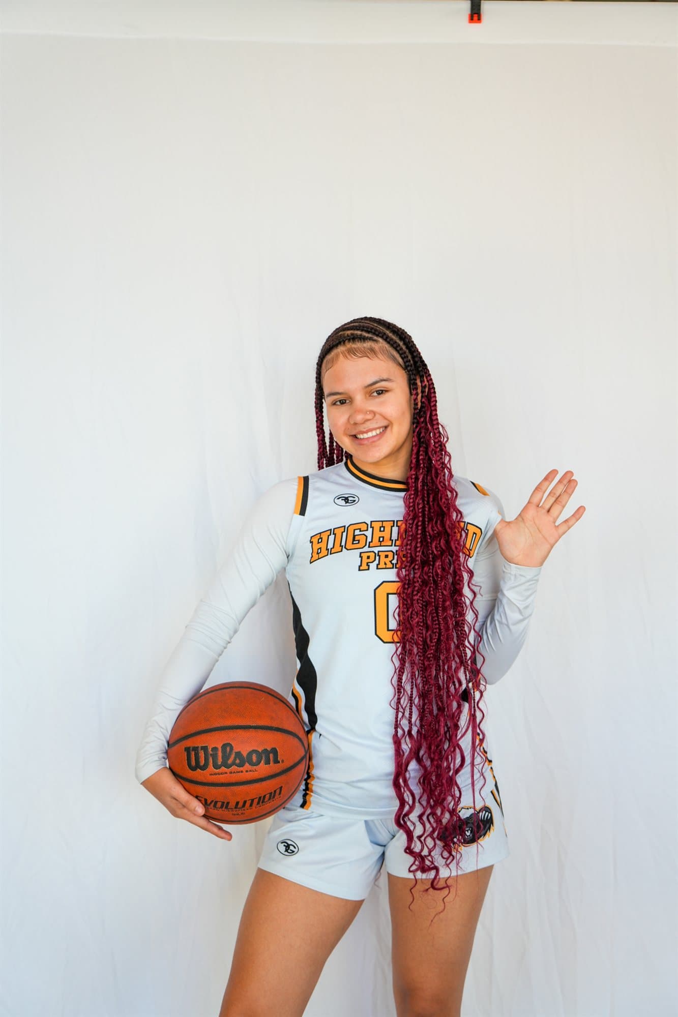 A Highland Prep basketball player with the ball