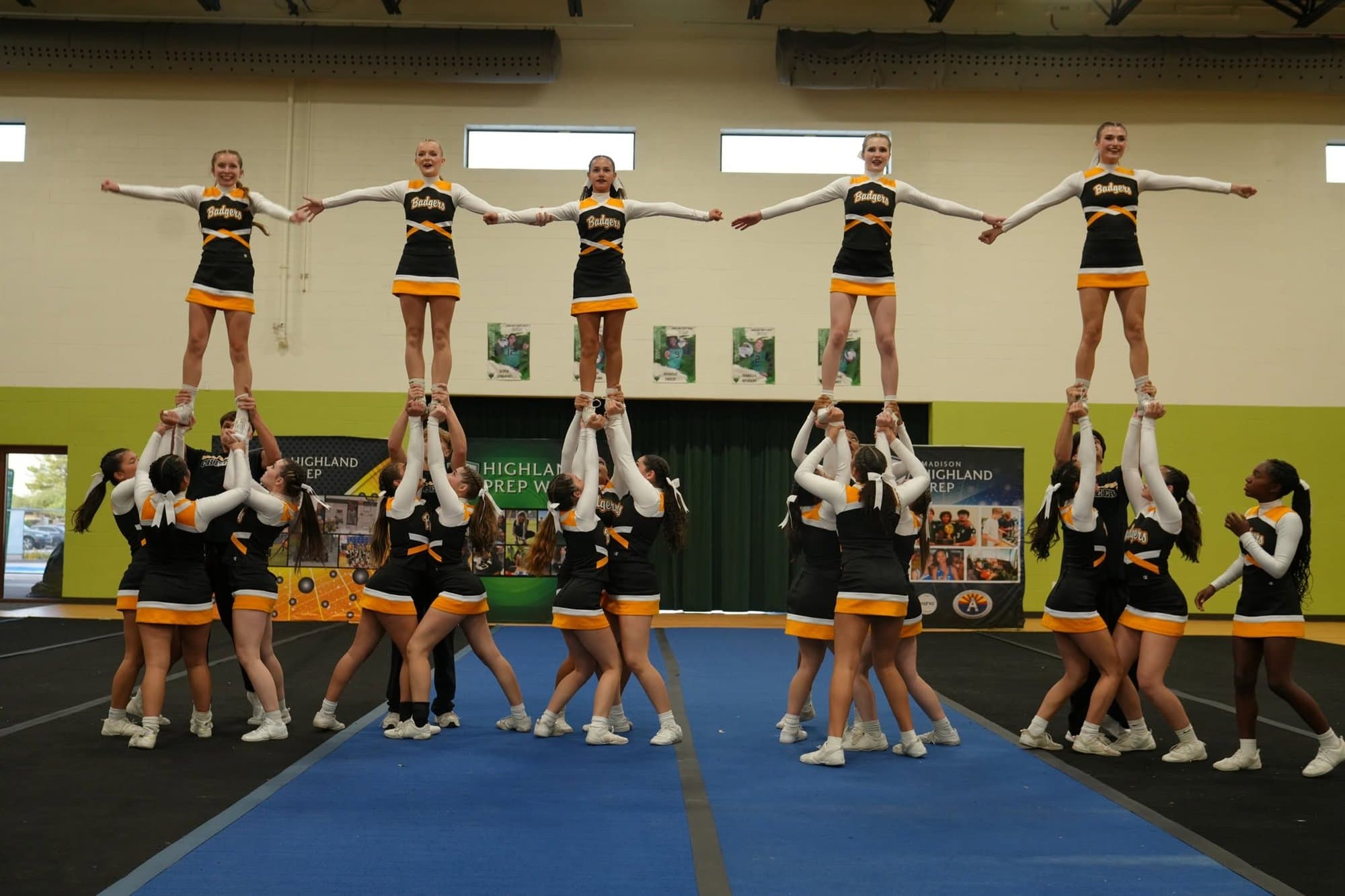 The Highland Prep cheer team performing a stunt