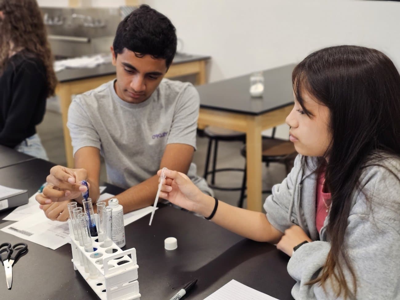 Highland Prep students running a chemistry experiment