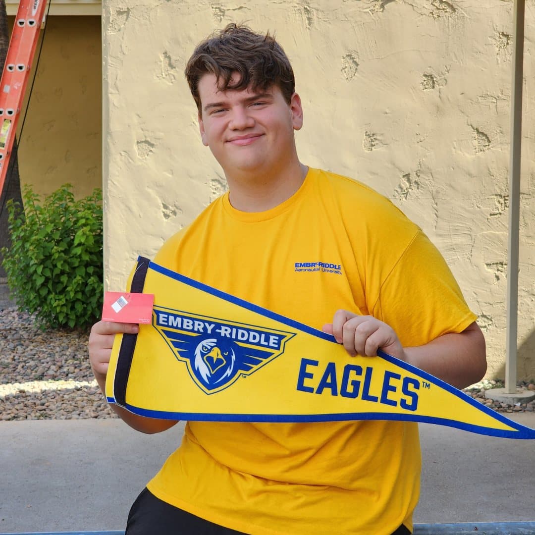 A Highland Prep senior with an Embry-Riddle pennant