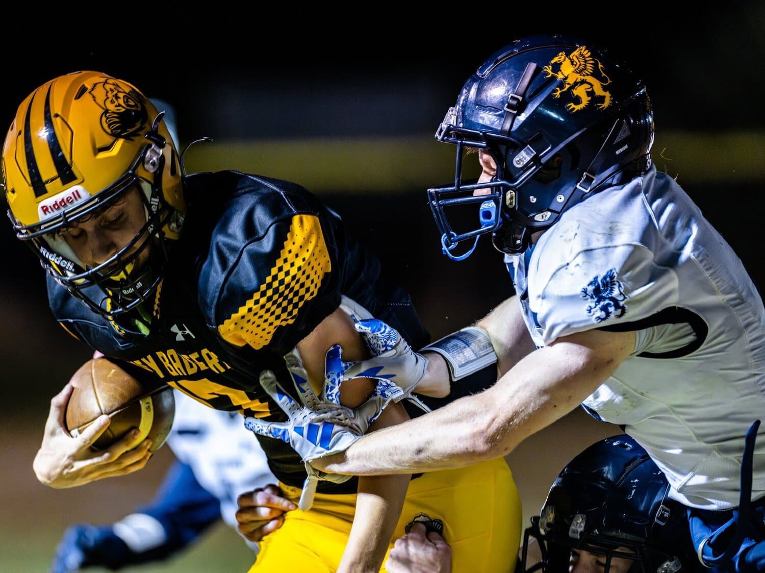 A Highland Prep player fighting for extra yards