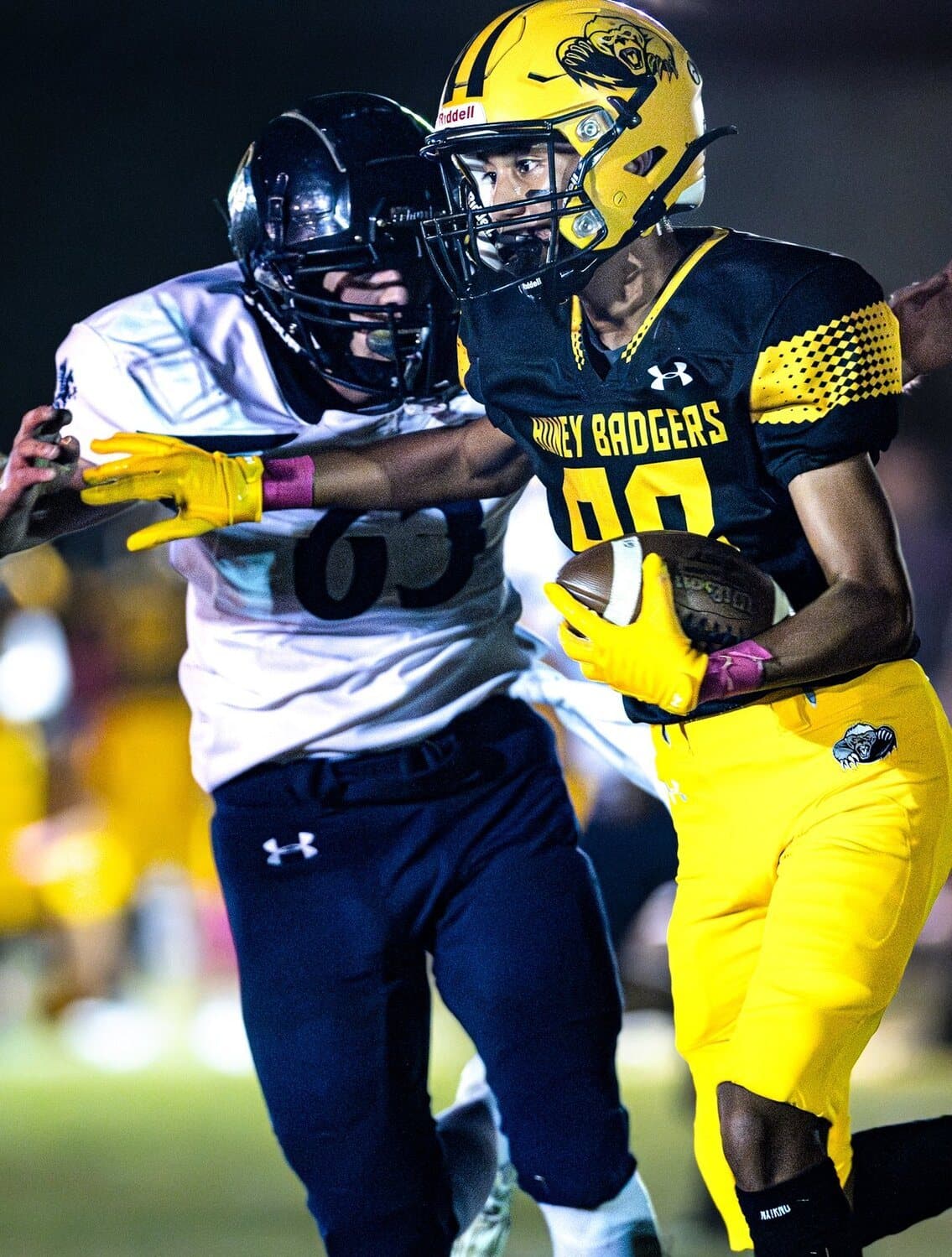 A Highland Prep running back breaking a tackle
