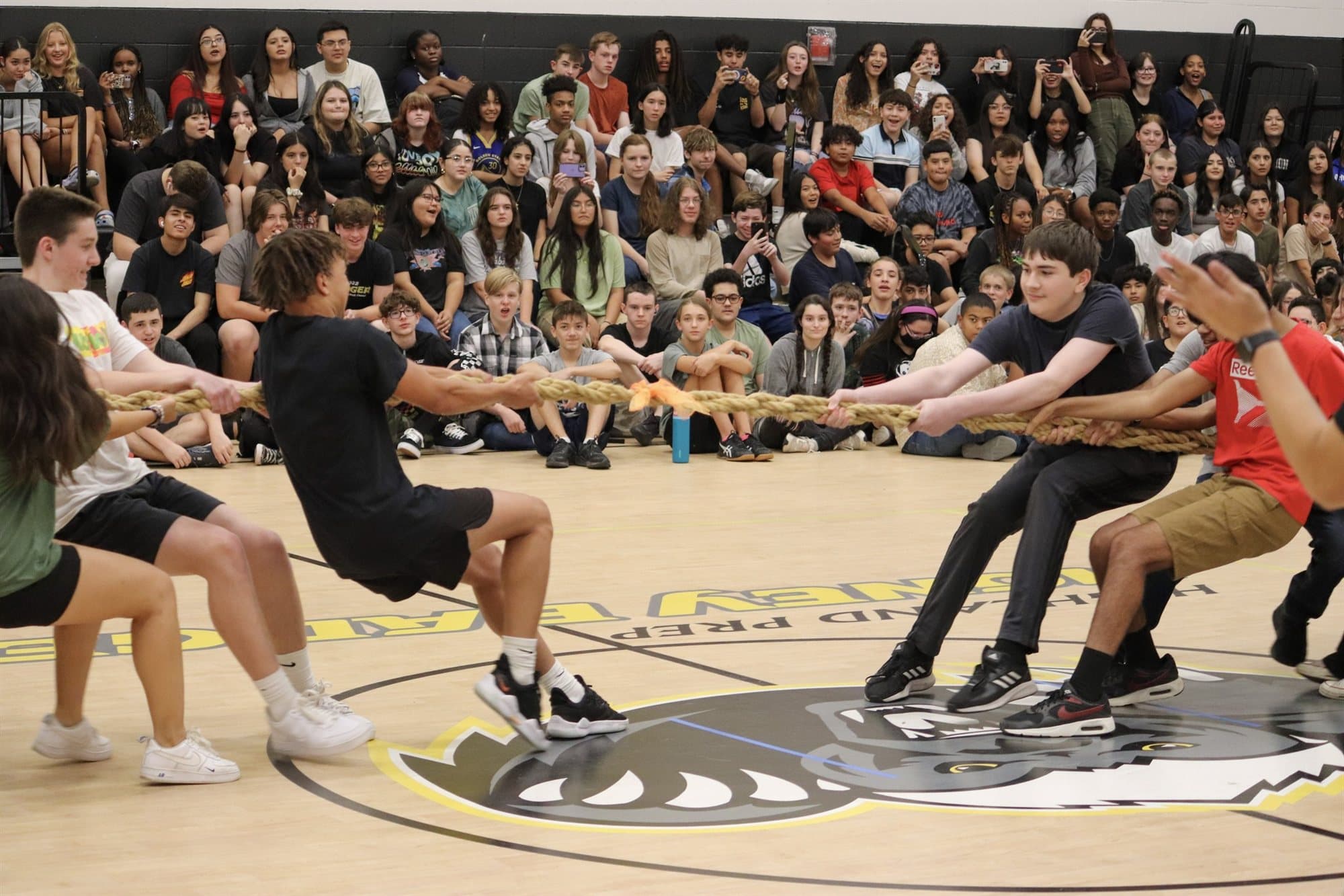 Highland Prep students in a tug of war at a pep assembly