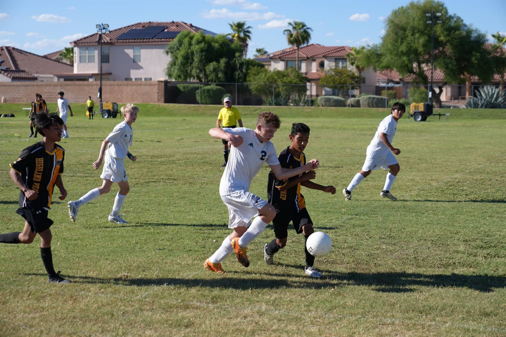A Highland Prep soccer player moving the ball upfield