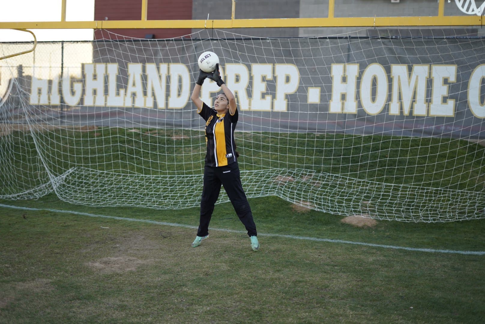 A Highland Prep goalkeeper celebrating with the ball