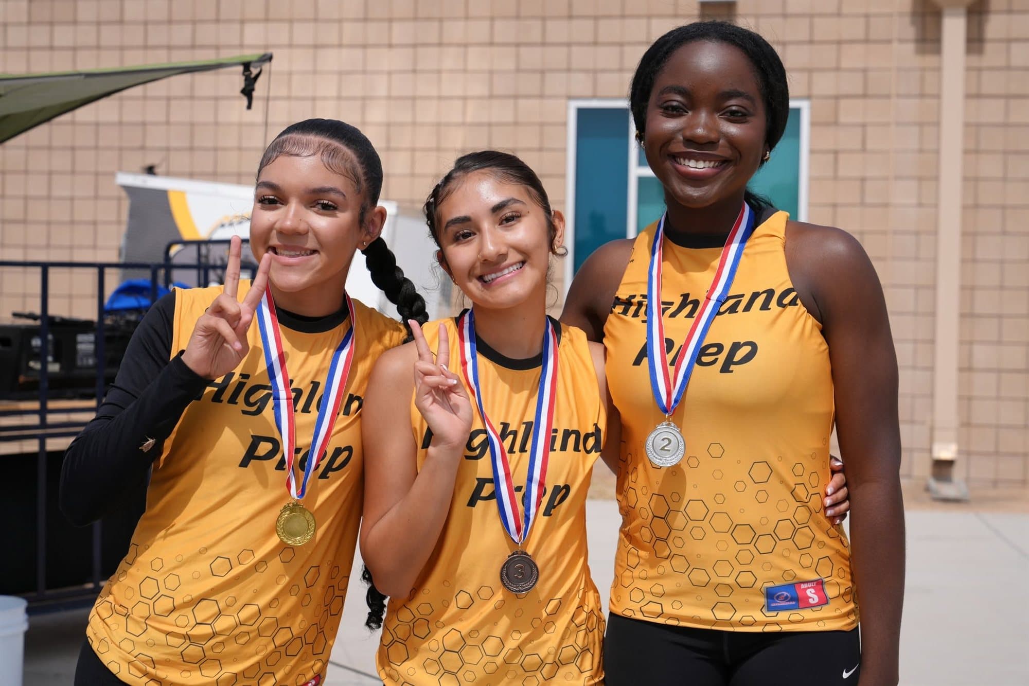 Highland Prep track athletes with their medals