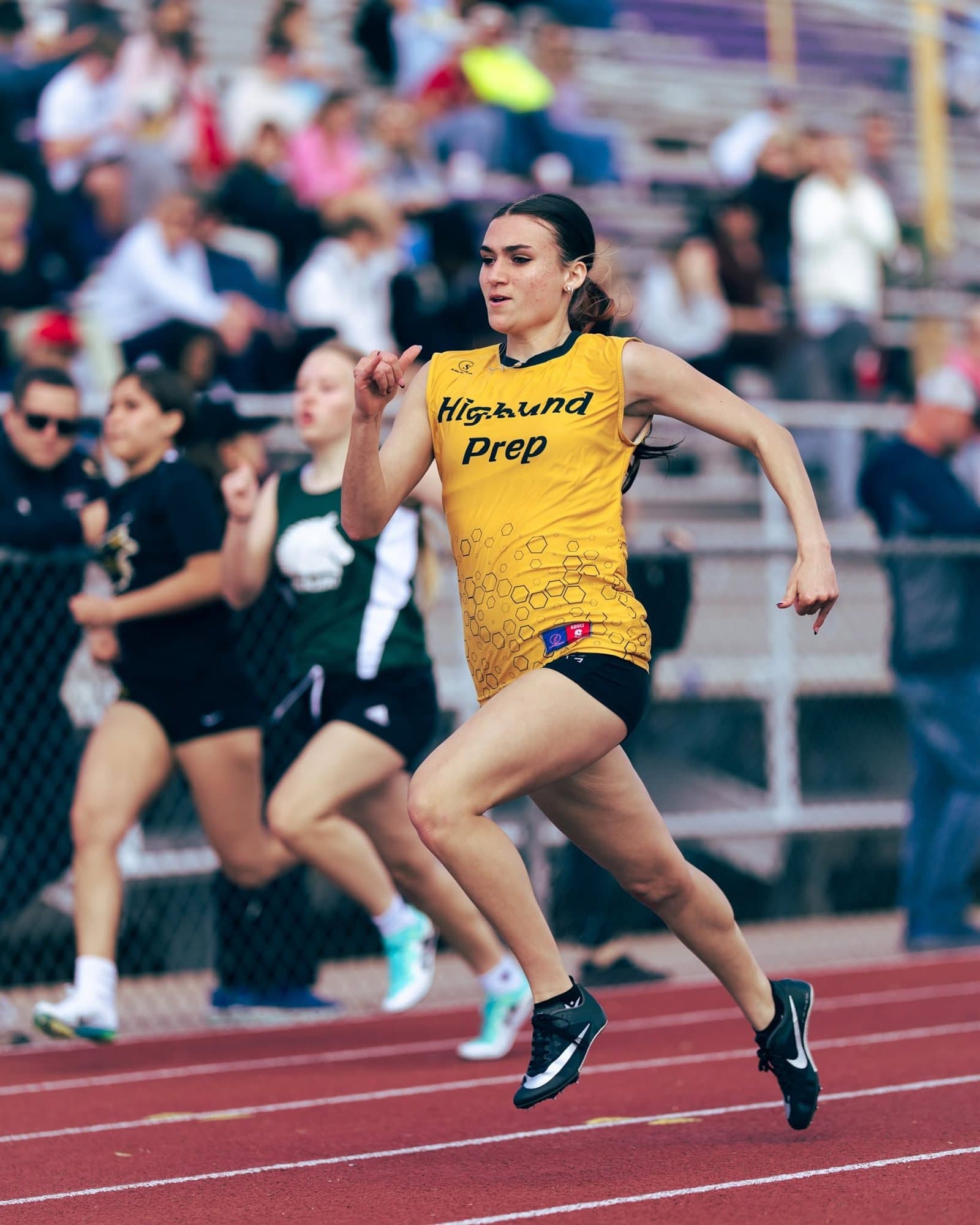 A Highland Prep sprinter racing down the track
