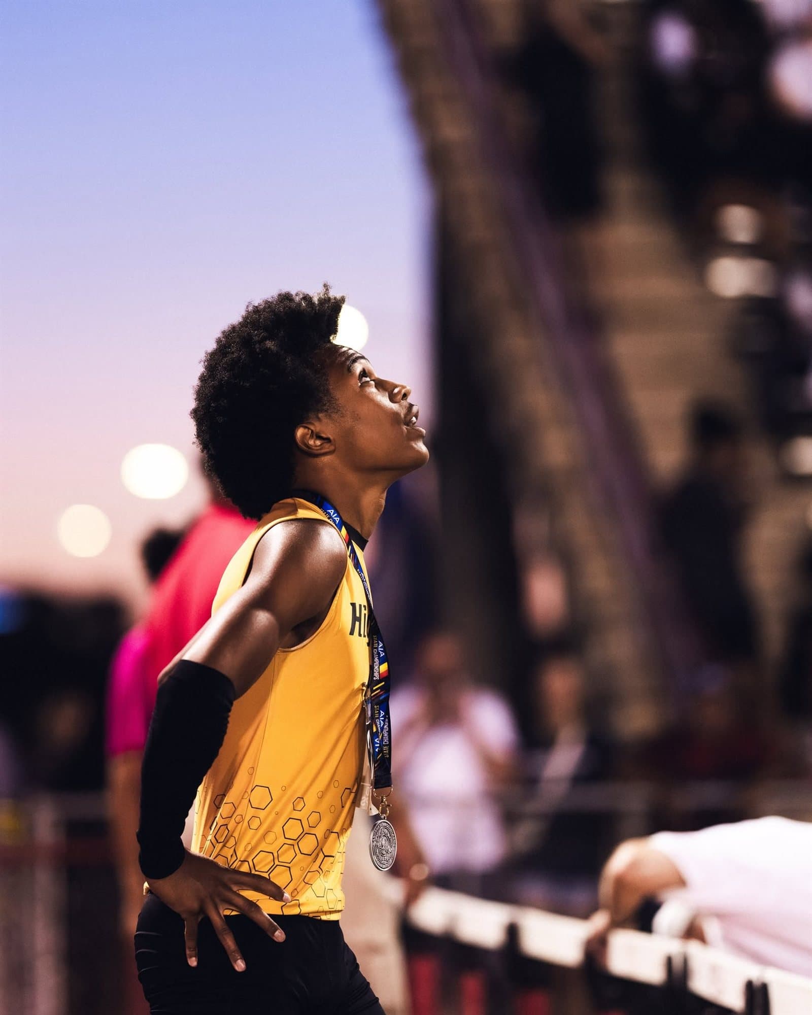 A Highland Prep sprinter at a sunset meet