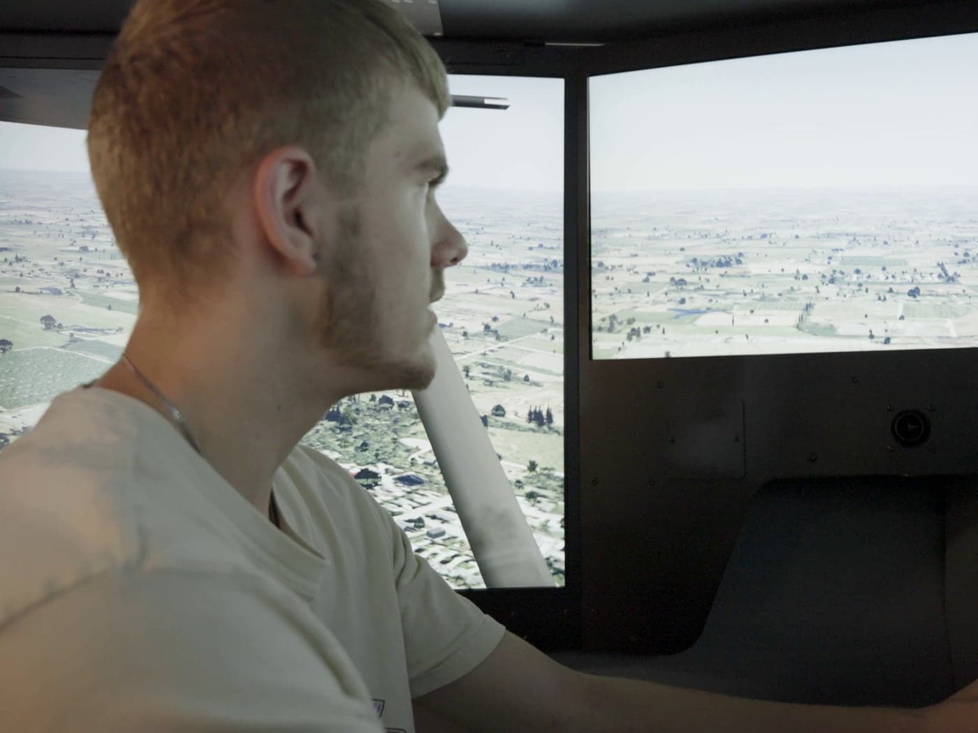 Highland Prep student flying the RedBird FMX flight simulator