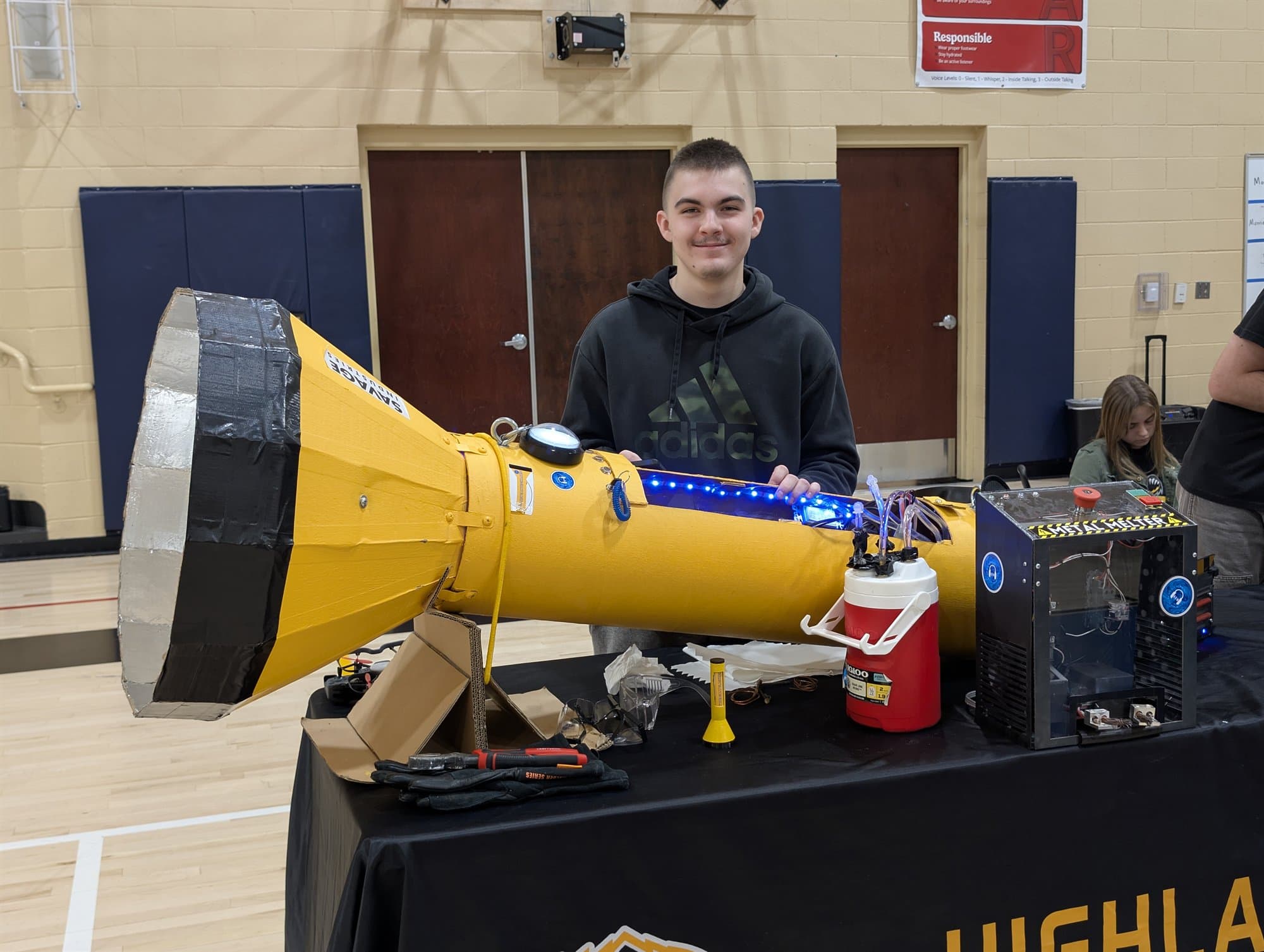 A Highland Prep student with a large air cannon they engineered and built