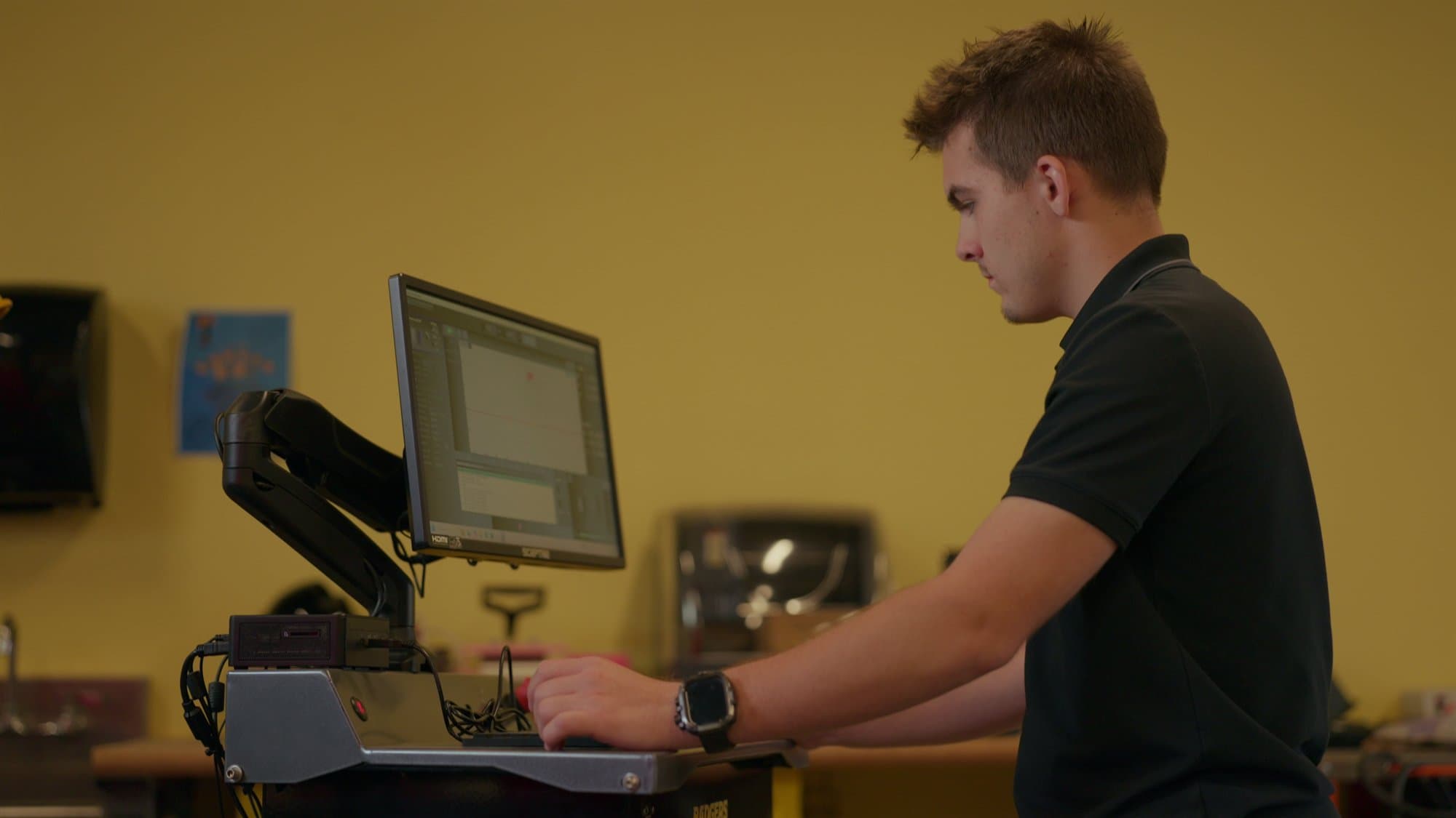 A Highland Prep student designing a project at a shop computer