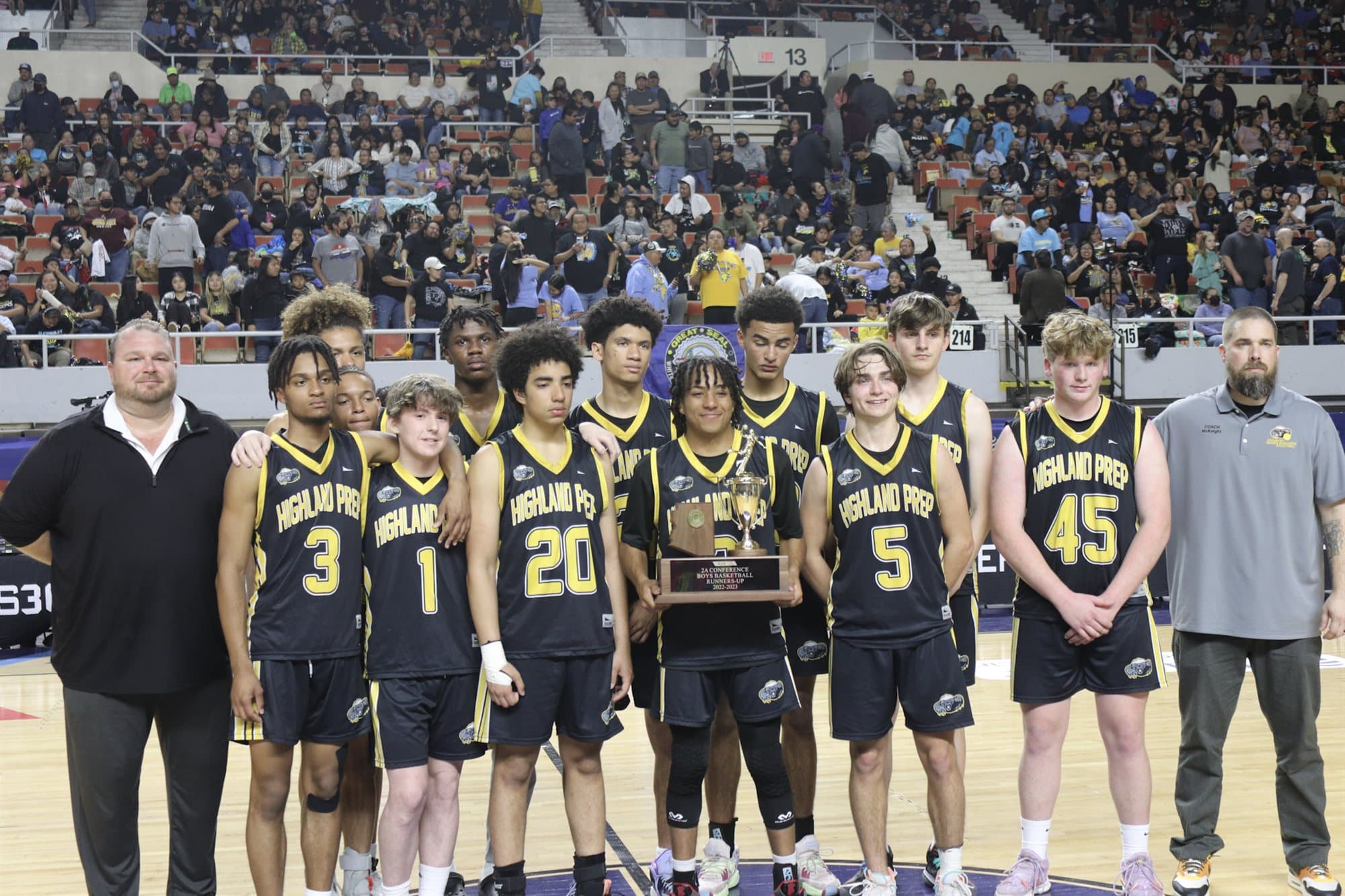 The Highland Prep boys basketball team with their trophy