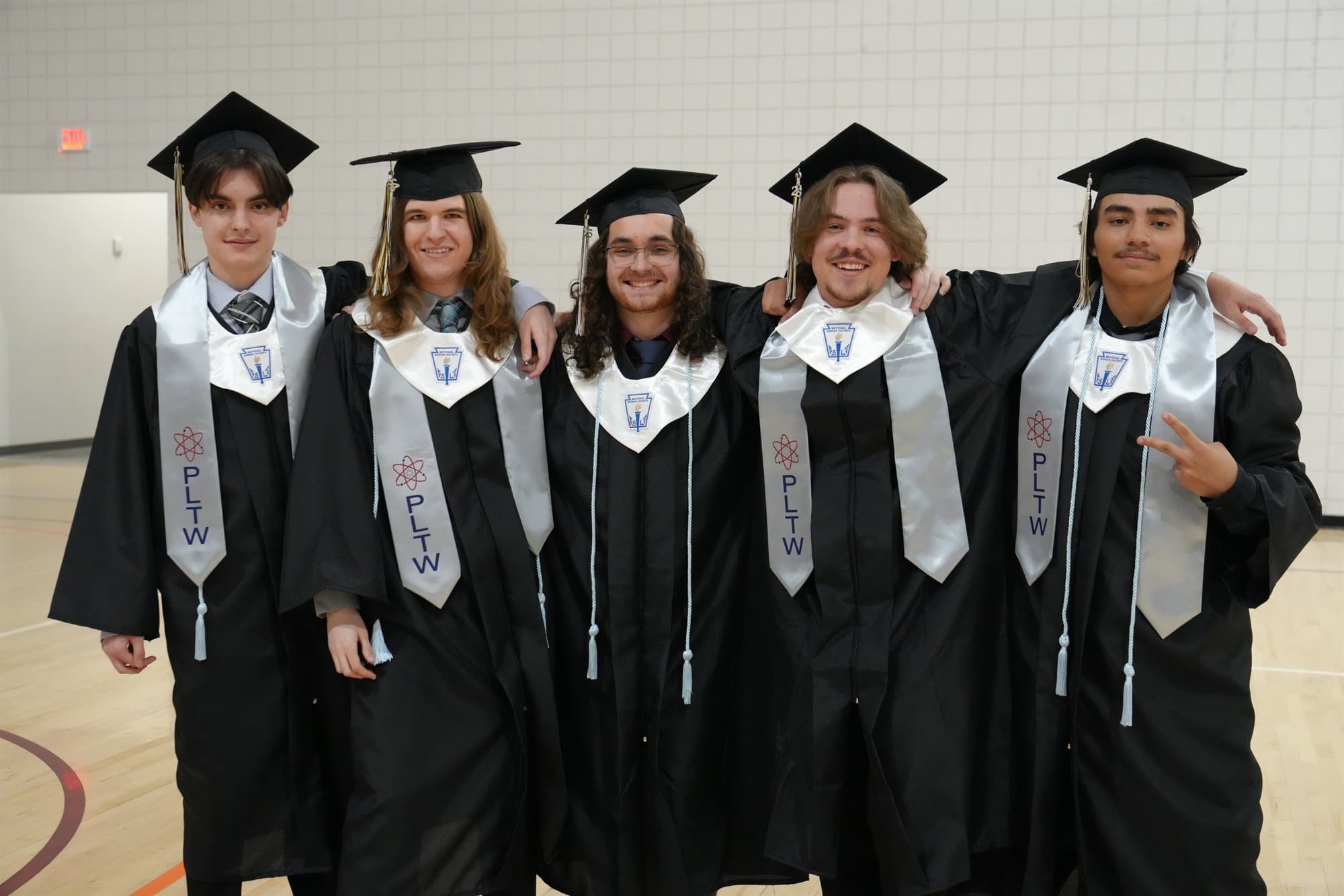 Highland Prep National Honor Society graduates in caps and gowns with honor stoles